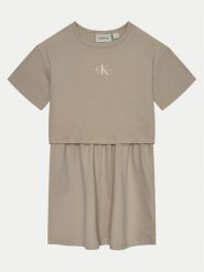Calvin Klein Jeans Sukienka codzienna IG0IG02770 Beżowy Relaxed Fit. Brązowe sukienki dziewczęce Calvin Klein Jeans, bez wzorów, z bawełny, bez ramiączek, proste. Za 209.99 zł.