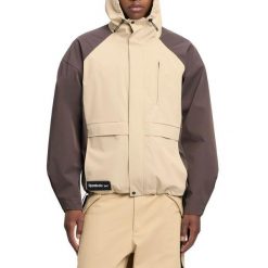Kurtka REEBOK UTILITY SHELL JACKE Brązowy. Brązowe kurtki damskie Reebok, bez wzorów, z tkaniny, bez kaptura. Za 597.99 zł.