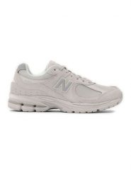 New Balance Skórzane sneakersy "2002R" w kolorze kremowym rozmiar: 37,5. Brązowe obuwie sportowe damskie New Balance, z materiału, bez zapięcia. Za 543.99 zł.