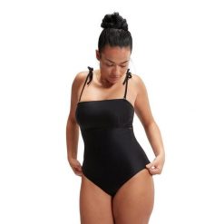 SPEEDO Modelujący kostium kąpielowy bandeau Czarny UK 38. Czarne stroje jednoczęściowe Speedo, bez wzorów, z tkaniny. Za 354.60 zł.