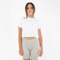 Krótkie damskie T-shirt CROPPED TEE białe. Białe t-shirty damskie LEGEA, bez wzorów, bez kołnierzyka. Za 52.00 zł.
