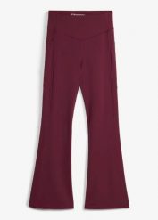 Wygodne legginsy sportowe z kieszonką na telefon i poszerzanymi nogawkami, z szybkoschnącego materiału. Czarne legginsy damskie bonprix, bez wzorów, z materiału. Za 124.99 zł.