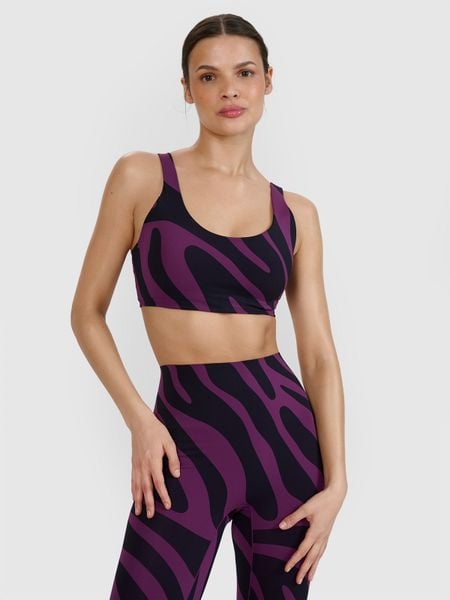 4F Biustonosz do jogi i pilatesu ze średnim wsparciem - fioletowy S. Fioletowe biustonosze sportowe damskie 4F, bez wzorów, z dzianiny. W wyprzedaży za 59.99 zł.