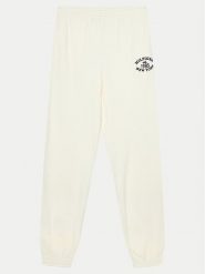 Tommy Hilfiger Spodnie dresowe Monotype KG0KG08107 Écru Regular Fit. Spodnie dresowe dziewczęce Tommy Hilfiger, bez wzorów, z dresówki. Za 179.99 zł.