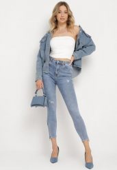 Jasnoniebieskie Bawełniane Jeansy Skinny z Przetarciami Erliaxa. Niebieskie jeansy damskie Born2be, bez wzorów, z bawełny. Za 89.99 zł.