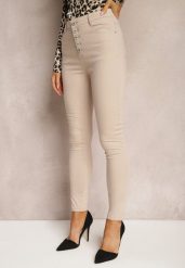 Beżowe Spodnie Skinny Winvienne. Brązowe rurki damskie Renee, w ażurowe wzory, z jeansu, z podwyższonym stanem. Za 59.99 zł.