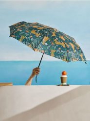 Parasol automatyczny z motywem panter - zielony. Zielone szorty damskie Sinsay, bez wzorów. W wyprzedaży za 12.99 zł.