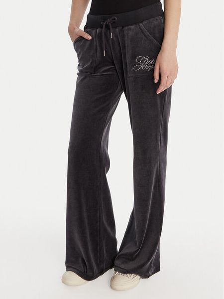 Guess Spodnie dresowe W6RB32 KCUF1 Granatowy Regular Fit. Niebieskie spodnie dresowe damskie Guess, xs, z aplikacjami, z bawełny. Za 389.99 zł.