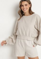 Beżowa Bluzka z Bawełny o Nietoperzowym Kroju z Wiązaniem Sepene. Brązowe bluzki damskie Born2be, z aplikacjami, z bawełny, eleganckie, bez kołnierzyka, bez ramiączek. Za 119.99 zł.