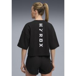 Damska skrócona koszulka PUMA x HYROX Lifestyle PUMA Black. Czarne bluzki damskie Puma, s, bez wzorów, bez kołnierzyka, bez ramiączek. Za 179.00 zł.