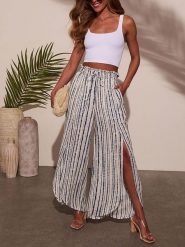 Milan Kiss Spodnie w kolorze niebiesko-białym rozmiar: L. Białe spodnie materiałowe damskie Milan Kiss, bez wzorów, z materiału. Za 108.45 zł.