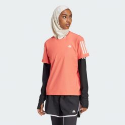 Koszulka Own The Run. Czerwone koszulki damskie Adidas, xs, bez wzorów, z materiału, bez kołnierzyka, bez ramiączek. Za 148.95 zł.