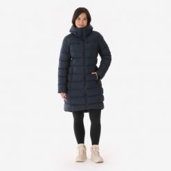 Kurtka turystyczna zimowa damska Quechua MH900 długa. Niebieskie kurtki damskie QUECHUA, na zimę, m, bez wzorów, z materiału, z kapturem. Za 349.99 zł.