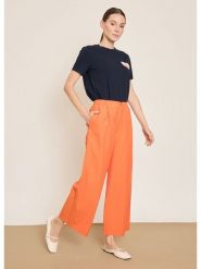 BGN Spodnie w kolorze pomarańczowym rozmiar: 38. Pomarańczowe spodnie materiałowe damskie BGN, bez wzorów, z materiału. Za 121.99 zł.