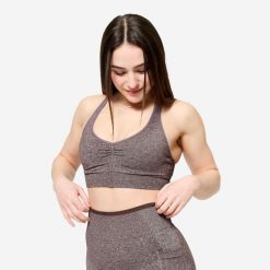 Stanik sportowy Decathlon. Białe biustonosze sportowe damskie DOMYOS, bez wzorów, ze skóry. Za 89.99 zł.