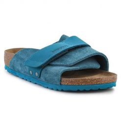 Klapki damskie Birkenstock Kyoto. Niebieskie klapki damskie Birkenstock, bez wzorów, z materiału, bez obcasa, bez zapięcia. Za 785.95 zł.