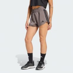Szorty treningowe Pacer Workout Woven High Rise. Brązowe obuwie sportowe damskie Adidas, bez zapięcia, na fitness i siłownię. Za 149.00 zł.