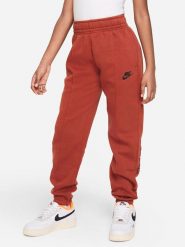 Nike Spodnie dresowe w kolorze ceglanym rozmiar: L. Pomarańczowe spodnie dresowe damskie Nike, l, bez wzorów, z bawełny. Za 140.53 zł.