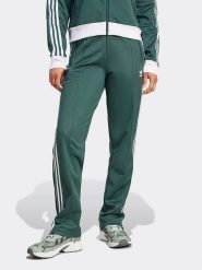 Adidas Spodnie dresowe w kolorze zielonym rozmiar: L. Zielone spodnie dresowe damskie Adidas, l, bez wzorów, z dresówki. Za 197.63 zł.