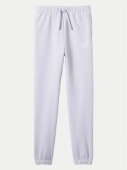 Gap Spodnie dresowe 486496-00 Fioletowy Regular Fit. Fioletowe spodnie dresowe dziewczęce GAP, bez wzorów, z bawełny. Za 99.99 zł.