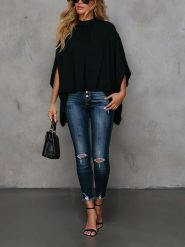 Milan Kiss Bluzka w kolorze czarnym rozmiar: M. Czarne bluzki damskie Milan Kiss, m, bez wzorów, bez kołnierzyka, bez ramiączek. Za 191.88 zł.