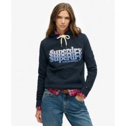 Kaptur Warstwowy. Niebieskie koszulki sportowe damskie Superdry, bez wzorów, bez ramiączek. Za 339.10 zł.