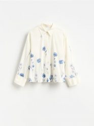 Bawełniana koszula w kwiaty - złamana biel. Koszule damskie Reserved, l, bez wzorów, z bawełny, bez kołnierzyka, bez ramiączek. Za 139.99 zł.