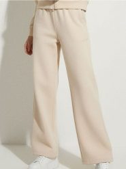 Spodnie dresowe wide leg - kremowy. Białe spodnie sportowe damskie Sinsay, l, bez wzorów, z dresówki. Za 39.99 zł.