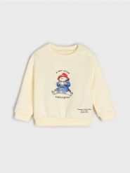 Bawełniana bluza z nadrukiem Paddington - kremowy. Białe bluzy damskie Sinsay, l, bez wzorów, z bawełny, bez kaptura. Za 13.99 zł.