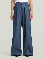 G-Star Spodnie w kolorze granatowym rozmiar: W30. Niebieskie spodnie materiałowe damskie G-Star, bez wzorów, z materiału. Za 301.64 zł.