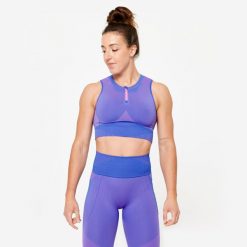 Koszulka fitness damska Domyos crop top bez rękawów. Czerwone koszulki damskie DOMYOS, m, bez wzorów, z elastanu, bez kołnierzyka, bez ramiączek. W wyprzedaży za 69.99 zł.