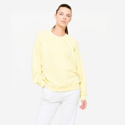 Bluza damska Domyos Gym & Pilates. Żółte bluzy damskie DOMYOS, m, bez wzorów, z materiału, bez kaptura. W wyprzedaży za 49.99 zł.