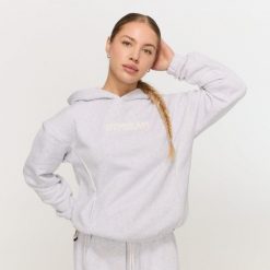 Bluza damska fitness z kapturem szara Varsity. Szare bluzy damskie GYMBEAM, m, bez wzorów, z materiału, z kapturem. Za 139.90 zł.