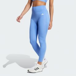 Legginsy 7/8 bez szwu z przodu Optime Essentials. Niebieskie legginsy damskie Adidas, l, bez wzorów. Za 219.00 zł.