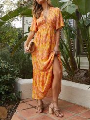 Milan Kiss Sukienka w kolorze pomarańczowo-żółtym rozmiar: M. Pomarańczowe sukienki damskie Milan Kiss, bez wzorów, bez ramiączek. Za 175.95 zł.