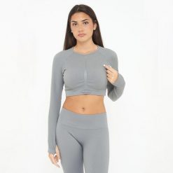 Koszulka Crop Top treningowa IMALA długie rękawy. Szare koszulki damskie LEGEA, bez wzorów, z elastanu, bez kołnierzyka, bez ramiączek. W wyprzedaży za 95.50 zł.