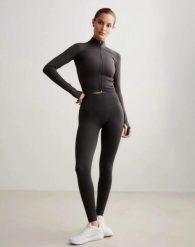 Damskie legginsy dłuższe, wysoki stan, invisible scrunch Shape Seamless szare. Szare legginsy damskie Aim'n, xl, bez wzorów, z dzianiny. Za 301.00 zł.