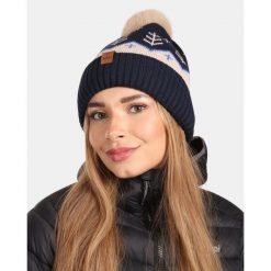 Damska czapka zimowa Kilpi CARMEN-W. Niebieskie czapki damskie Kilpi, na zimę, bez wzorów, z wełny. Za 60.57 zł.