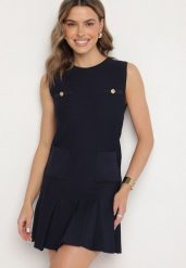 Granatowa Dzianinowa Sukienka z Wiskozą Zdobiona Plisami i Imitacją Kieszeni Ravima. Niebieskie sukienki damskie Born2be, z aplikacjami, z dzianiny, eleganckie, bez ramiączek. Za 139.99 zł.
