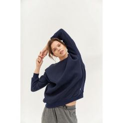 Bluza do jogi Moonholi Cozy AF Oversize Sweatshirt z bawełnianej dzianiny. Czerwone bluzy damskie MOONHOLI, s, bez wzorów, z bawełny, bez kaptura. Za 429.00 zł.