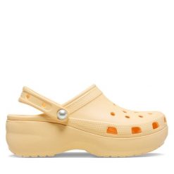Klapki Crocs. Żółte klapki damskie Crocs, bez wzorów, bez obcasa, bez zapięcia. Za 189.99 zł.