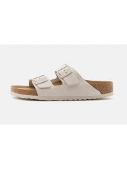 Birkenstock Skórzane klapki "Arizona" w kolorze kremowym rozmiar: 38. Brązowe klapki damskie Birkenstock, bez wzorów, ze skóry, z otwartym noskiem, bez obcasa, bez zapięcia. Za 430.46 zł.