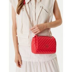 Torebka Guess. Pomarańczowe torebki wieczorowe damskie Guess, z aplikacjami, bez dodatków. Za 299.99 zł.