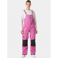 Spodnie Damskie Helly Hansen Pier 4.0 Bib. Czerwone kombinezony damskie Helly Hansen, bez wzorów, sportowe, bez kołnierzyka, bez ramiączek. Za 919.00 zł.