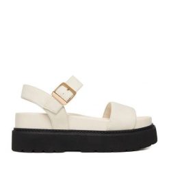 Sandały JENNY. Białe sandały damskie Jenny, bez wzorów, bez obcasa, na płaskiej podeszwie, bez zapięcia. Za 159.99 zł.