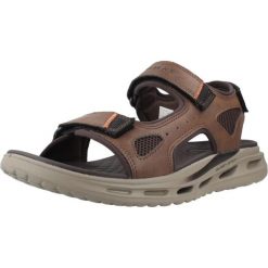 Sandały SKECHERS ORVAN SD GAMBLE Brązowy. Brązowe sandały damskie Skechers, bez wzorów, z materiału, bez obcasa, bez zapięcia. Za 390.00 zł.