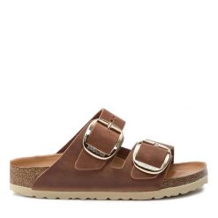 Klapki Birkenstock. Brązowe klapki damskie Birkenstock, bez wzorów, bez obcasa, bez zapięcia. Za 399.99 zł.