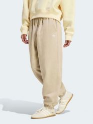 Adidas Spodnie dresowe w kolorze beżowym rozmiar: L. Brązowe spodnie dresowe damskie Adidas, l, bez wzorów, z dresówki. Za 174.95 zł.