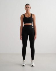 Damskie legginsy prążkowane bezszwowe, wydłużone, wysoki stan, czarne. Czarne legginsy damskie Aim'n, xs, bez wzorów, z elastanu, z podwyższonym stanem, na fitness i siłownię. Za 260.00 zł.