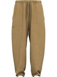 Under Armour Spodnie dresowe "Icon" w kolorze jasnobrązowym rozmiar: L. Brązowe spodnie dresowe damskie Under Armour, l, bez wzorów, z bawełny. Za 103.45 zł.